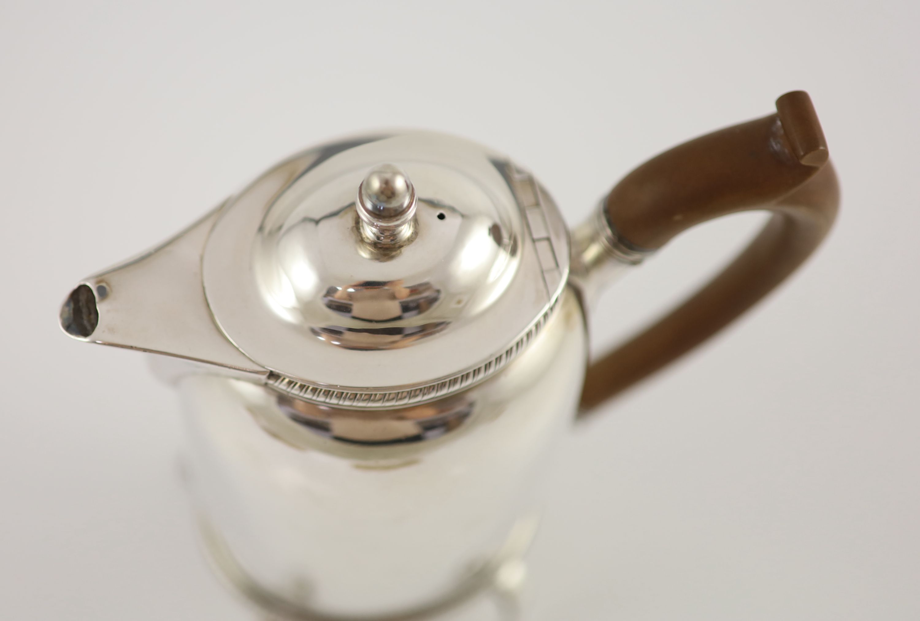 A George III silver oval biggin pot, John Edwards III, London, 1799, on stand with burner, John Edwards III, London, 1803